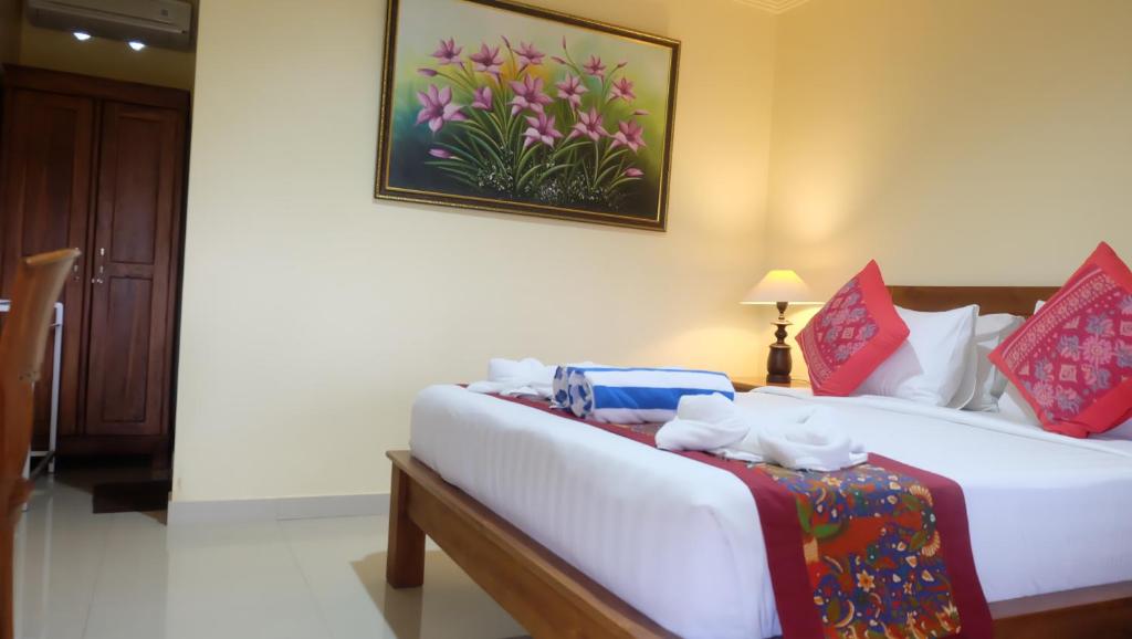 Postel nebo postele na pokoji v ubytování Buana Ubud Inn