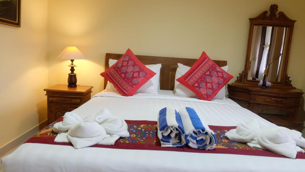 Postel nebo postele na pokoji v ubytování Buana Ubud Inn