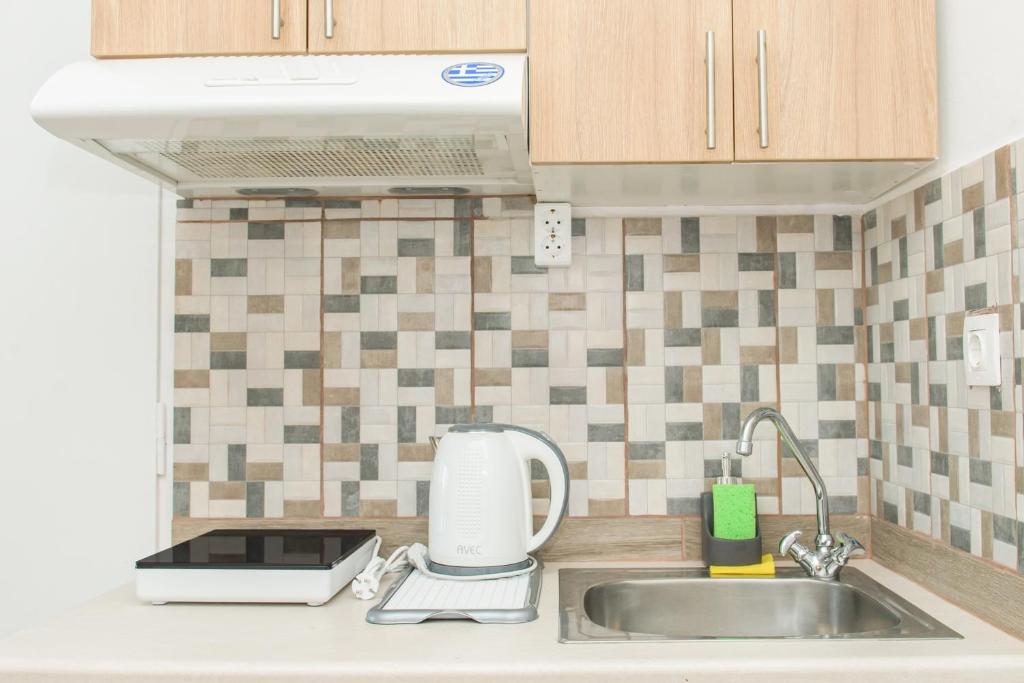 Kuchyň nebo kuchyňský kout v ubytování Kristina Stelios Apartment