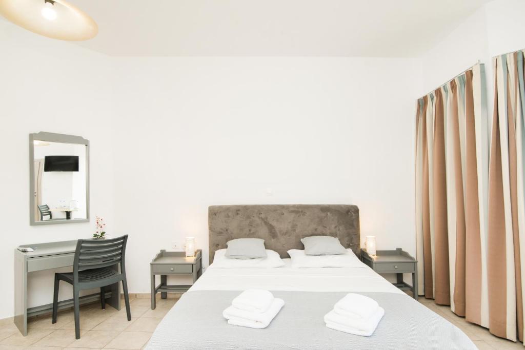 Postel nebo postele na pokoji v ubytování Kristina Stelios Apartment