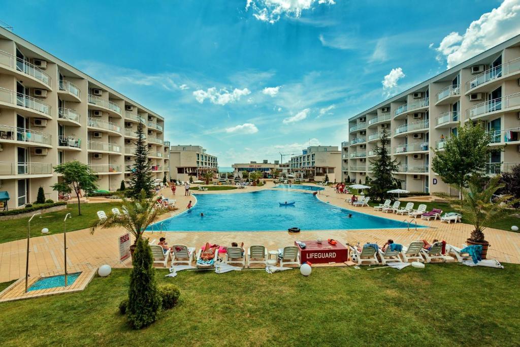 a large swimming pool in the middle of a resort at Apartment with terrace in Spa Complex in Burgas City