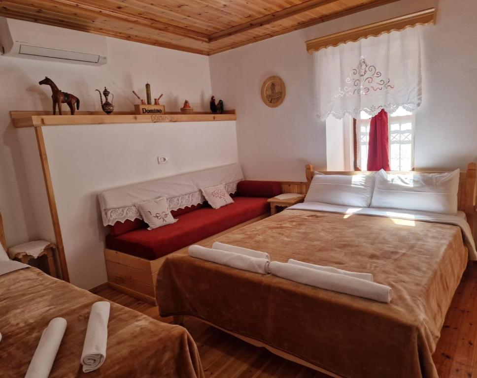 Postel nebo postele na pokoji v ubytování Hotel Domino