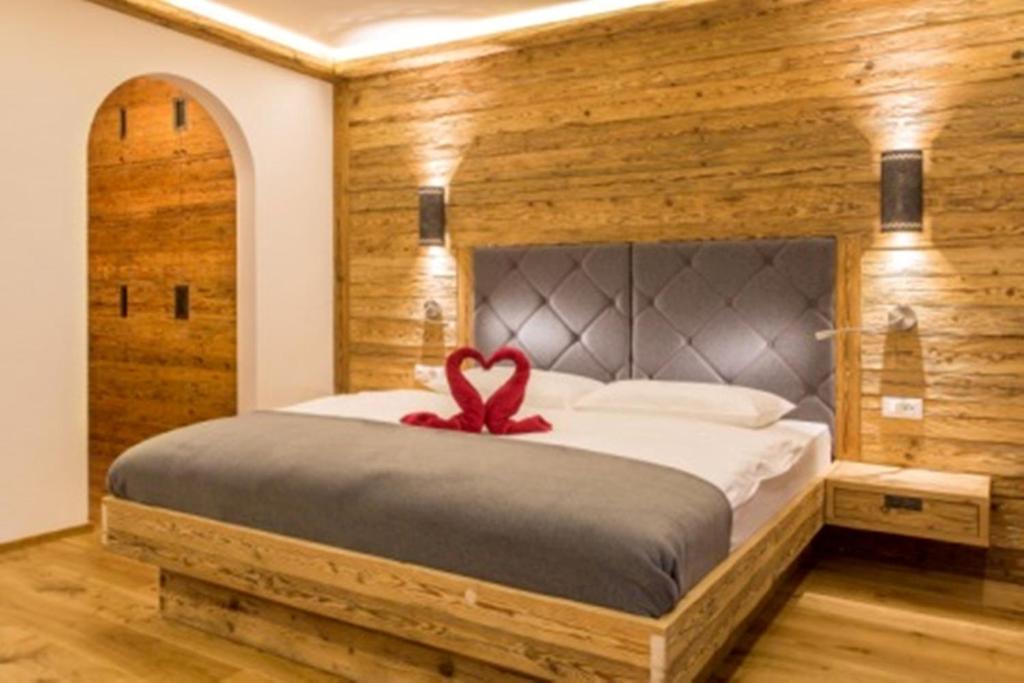 Voodi või voodid majutusasutuse Hotel Rosengarten toas