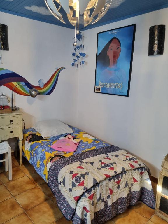 Postel nebo postele na pokoji v ubytování Gite Fa Mille maison bleu
