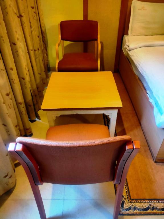 Postel nebo postele na pokoji v ubytování Hotel Roopa