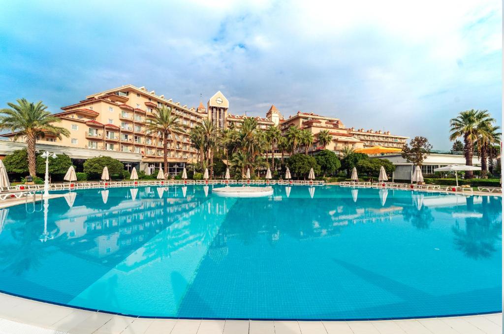 a large swimming pool in front of a resort at IC Hotels Santai Family Resort - Kids Concept in Belek