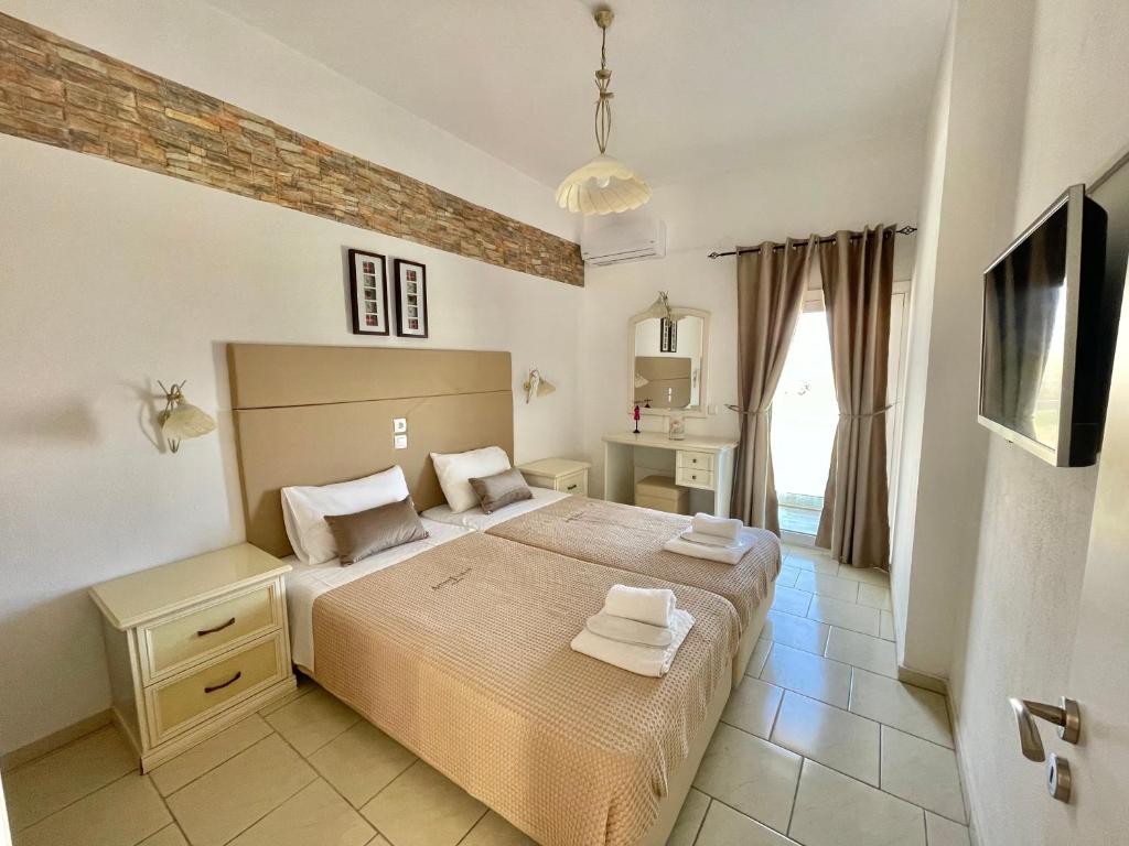 Postel nebo postele na pokoji v ubytování Sea View Apts & Suites by Pachiplex