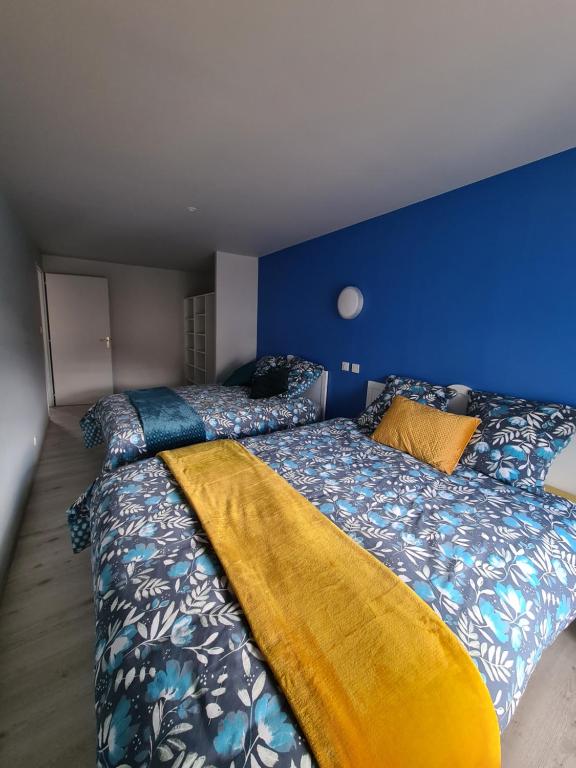 Letto o letti in una camera di L'Udon-Thani gîte de groupe à 4 min du Puy du Fou