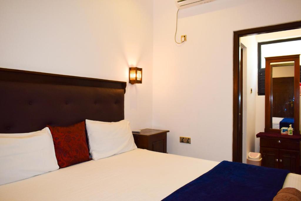 Postel nebo postele na pokoji v ubytování Alffa Guest Inn