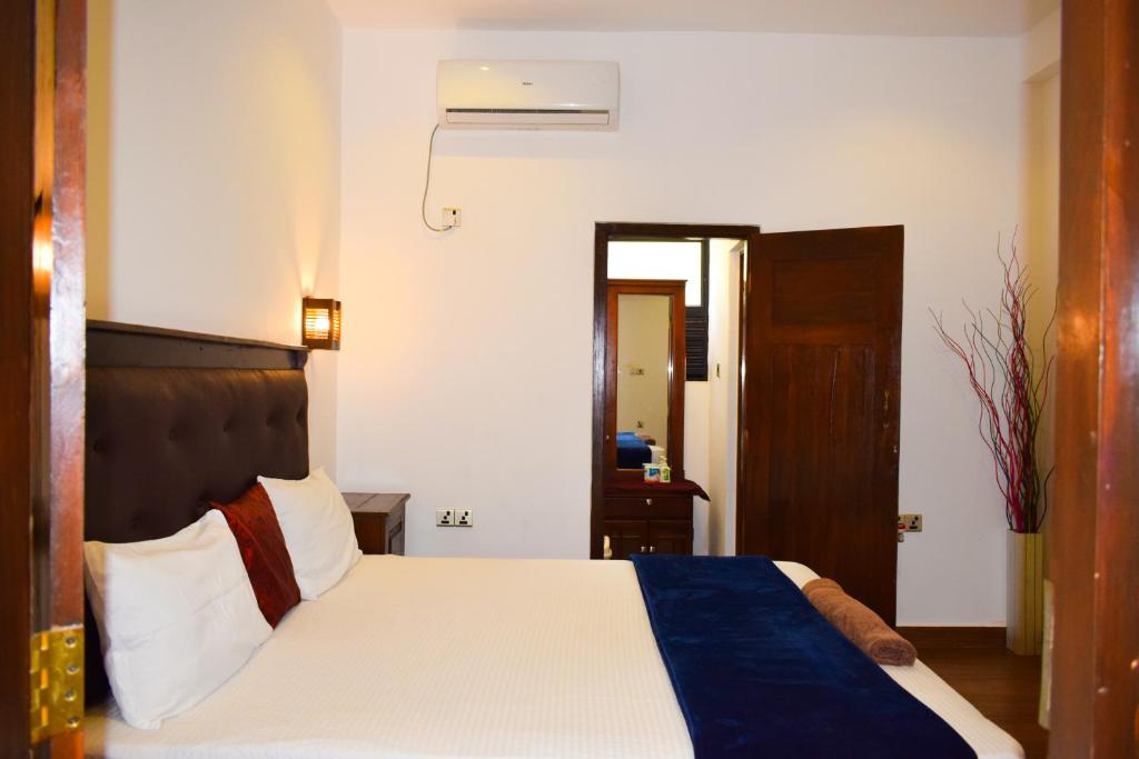 Postel nebo postele na pokoji v ubytování Alffa Guest Inn