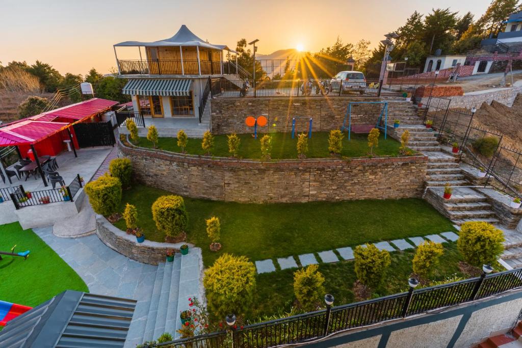 an aerial view of a garden and a building at Viable Inn by Vista Stays in Mukteswar