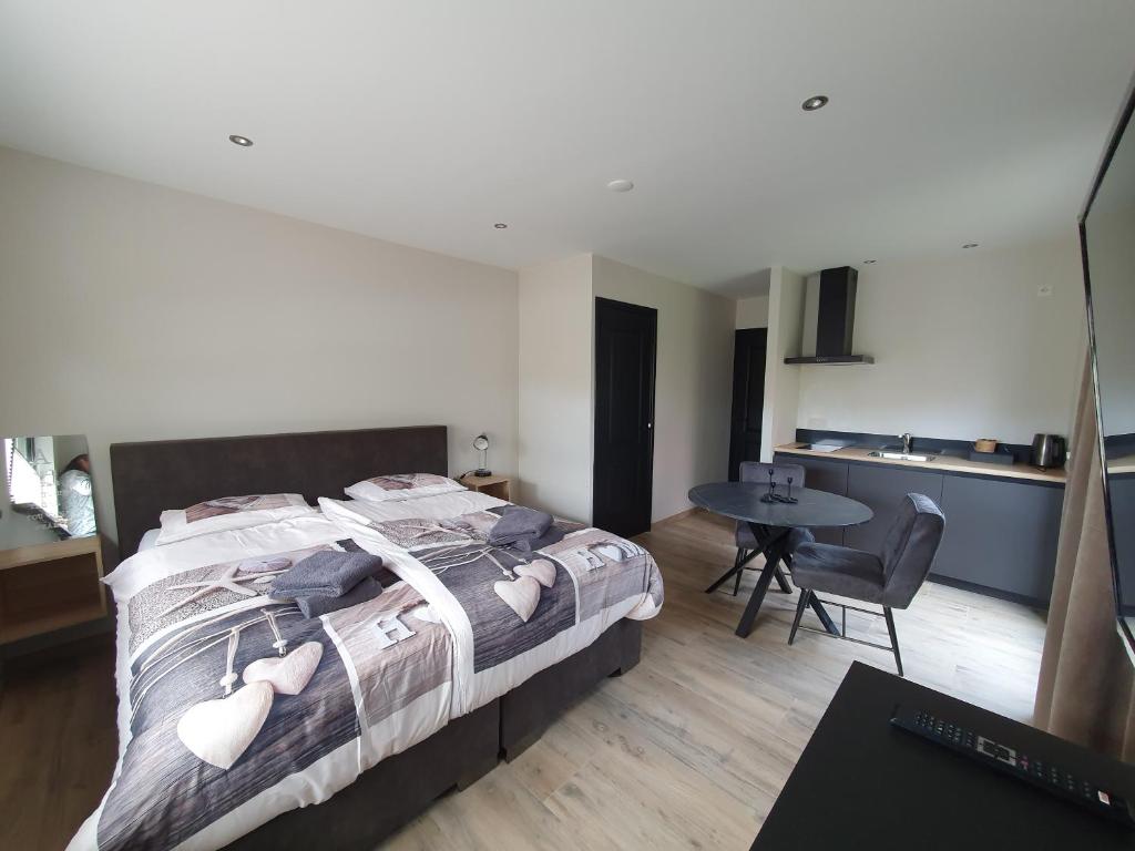Postel nebo postele na pokoji v ubytování B&B De Reede