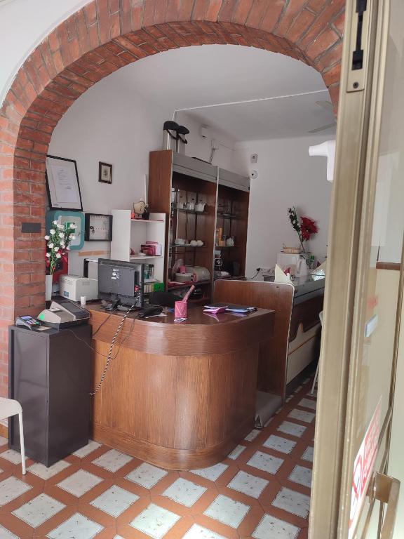 an entrance to a kitchen with an archway at Hotel Italia in Reggio Emilia