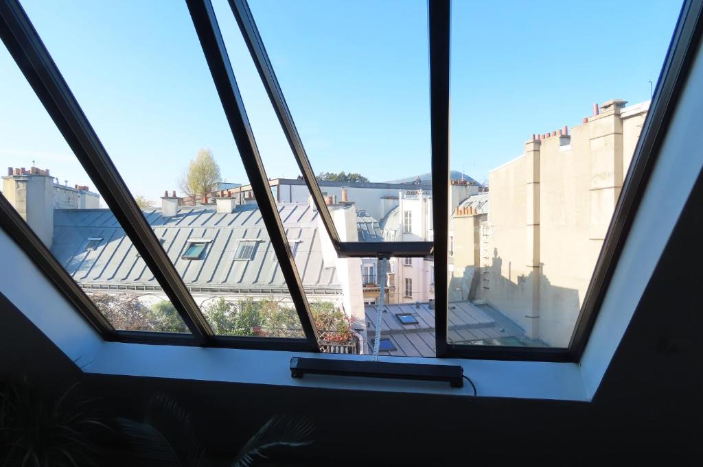 Fotografia z galérie ubytovania Loft avec vue sur Tour Eiffel v Paríži