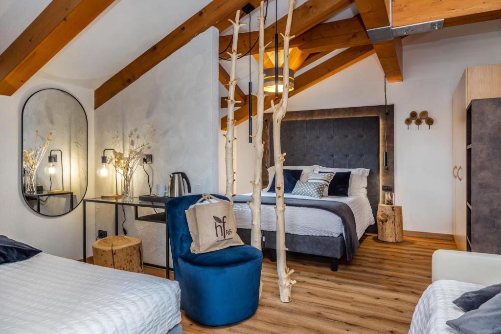 Postel nebo postele na pokoji v ubytování Hotel Folgarida