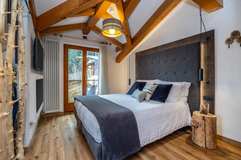 Postel nebo postele na pokoji v ubytování Hotel Folgarida