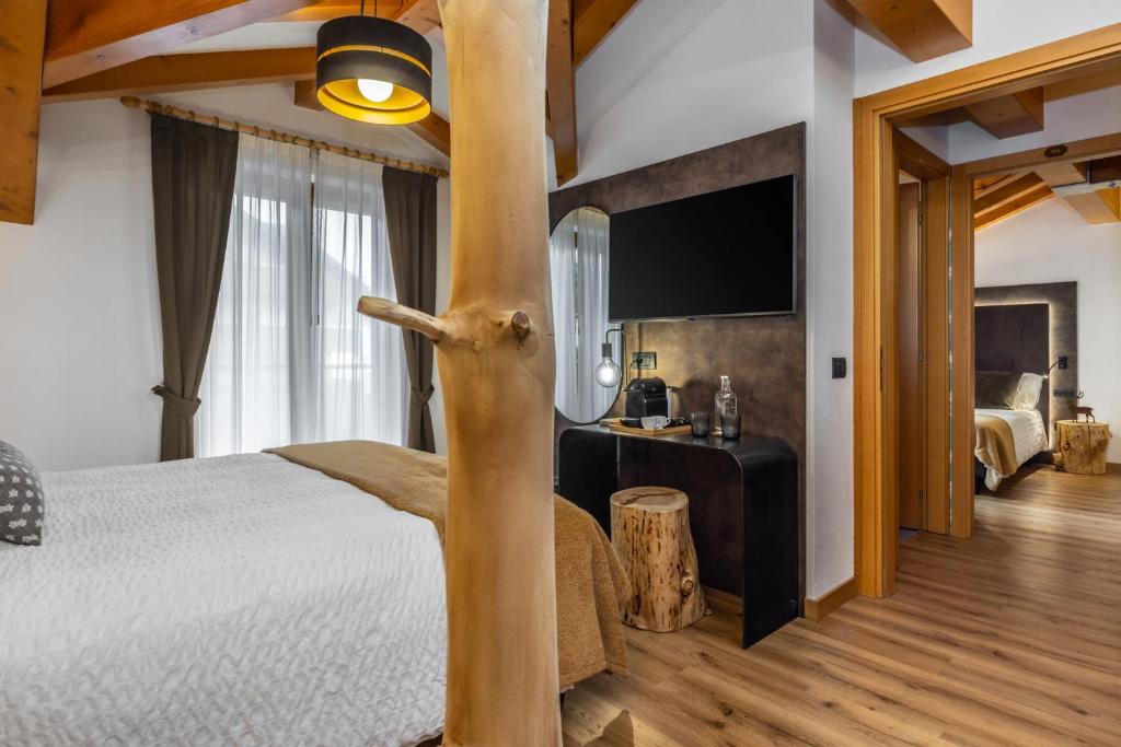 Postel nebo postele na pokoji v ubytování Hotel Folgarida