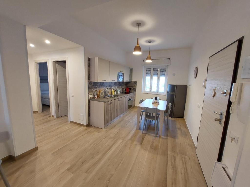 a large kitchen with a table and a counter at Da Enza in Taranto