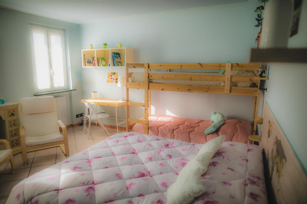 Postel nebo postele na pokoji v ubytování B&B LA MIMOSA E IL GELSOMINO