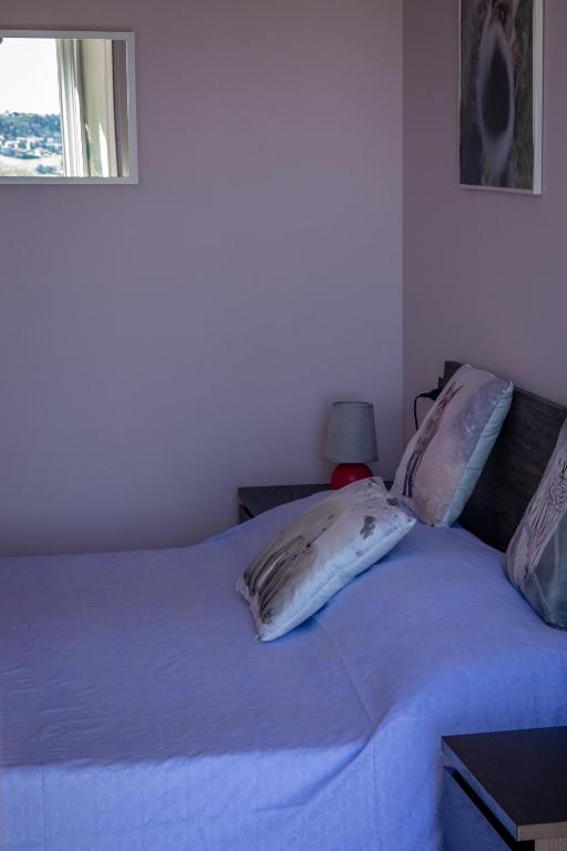 Postel nebo postele na pokoji v ubytování B&B LA MIMOSA E IL GELSOMINO