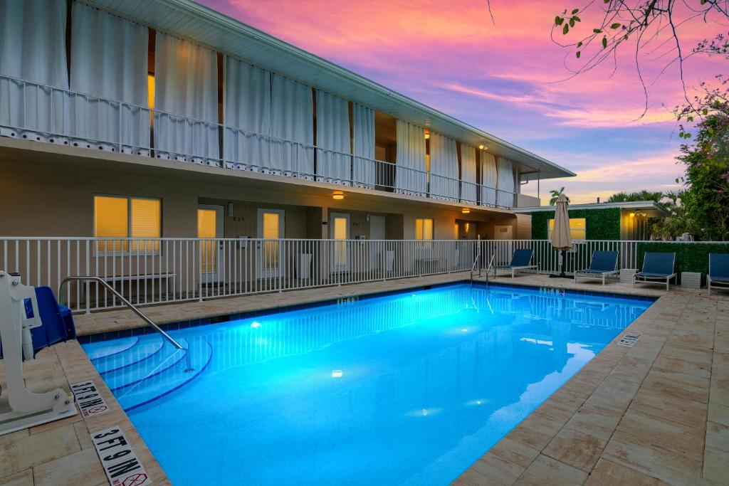 a large swimming pool in front of a building at Downtown Starfish 807 in Naples