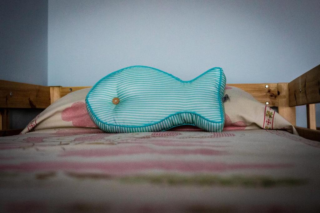 Postel nebo postele na pokoji v ubytování B&B LA MIMOSA E IL GELSOMINO