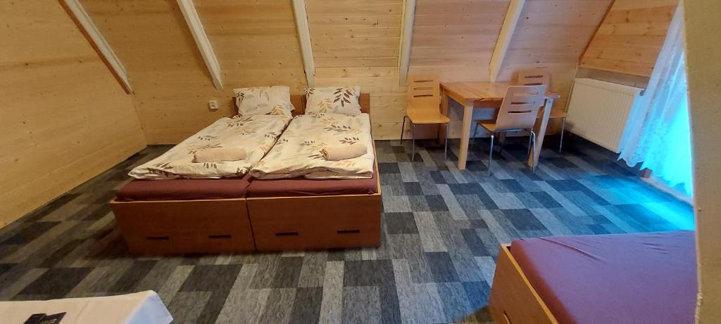 Postel nebo postele na pokoji v ubytování Penzion Svojanov