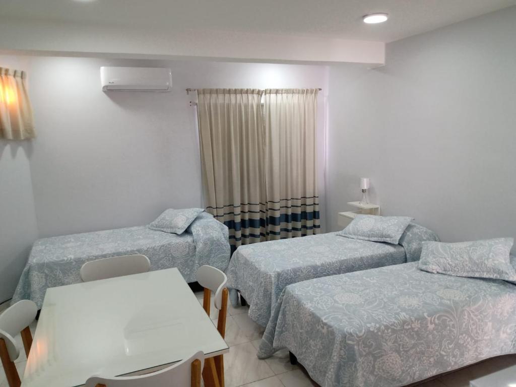 a hospital room with two beds and a table at COMPLEJO ECHAGUE in San Juan