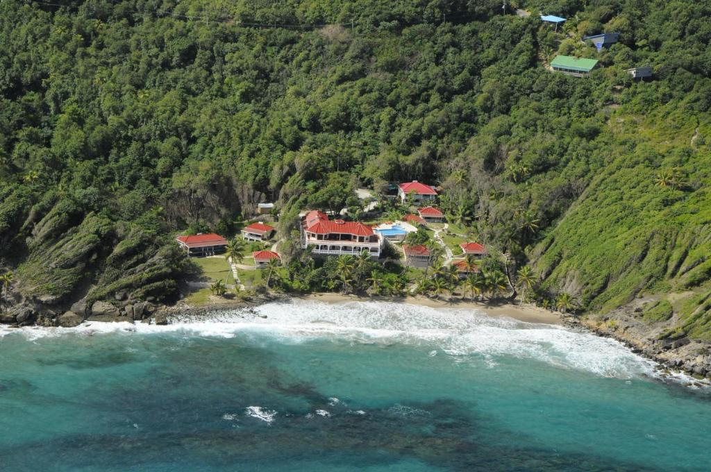 an aerial view of a resort on a beach at Petite Anse Hotel in Mount Alexander