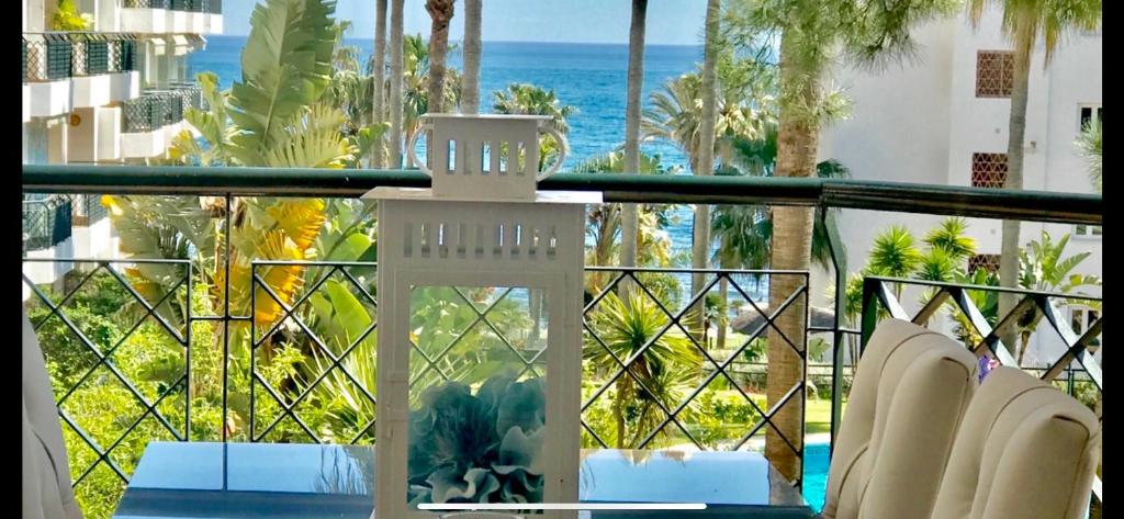 a balcony with chairs and a view of the ocean at MI CAPRICHO 9C BEACHFRONT- Apartment with sea view - Costa del Sol in La Cala de Mijas