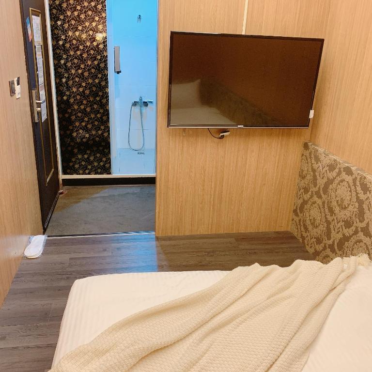 TV a/nebo společenská místnost v ubytování Meworld Hotel - Ximen