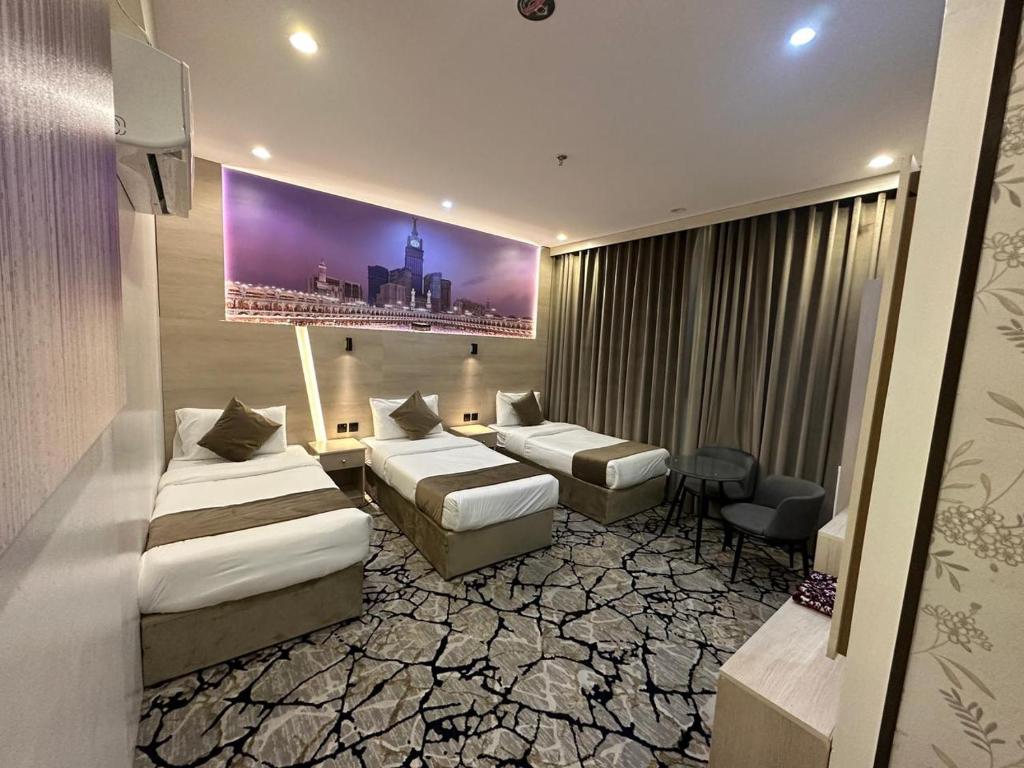 Postel nebo postele na pokoji v ubytování فندق اسكنت الحفاير - Askant Al Hafayer Hotel