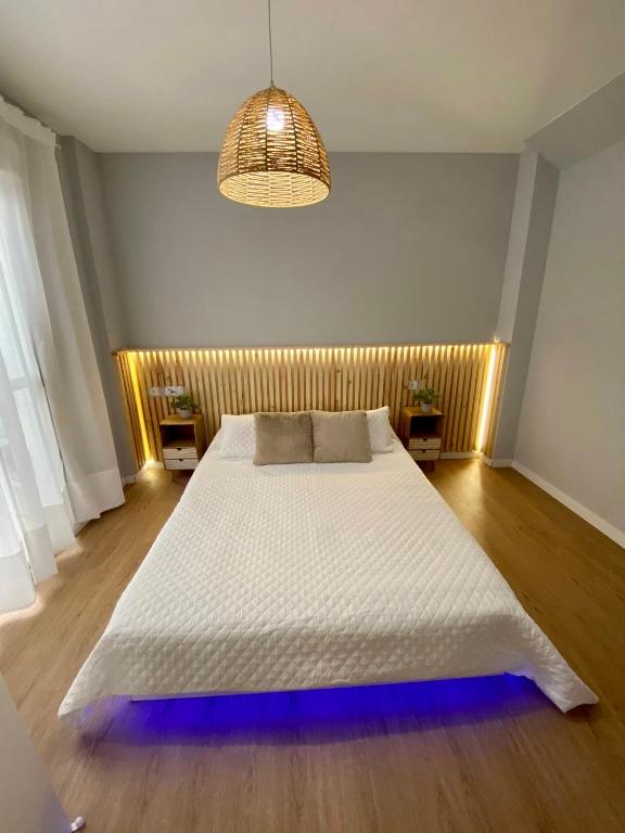 Łóżko lub łóżka w pokoju w obiekcie Amazon Malaga