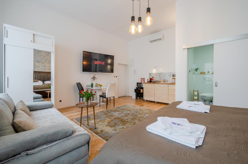 a living room with a couch and a table at Premium Wenceslas Square Apartments in Prague