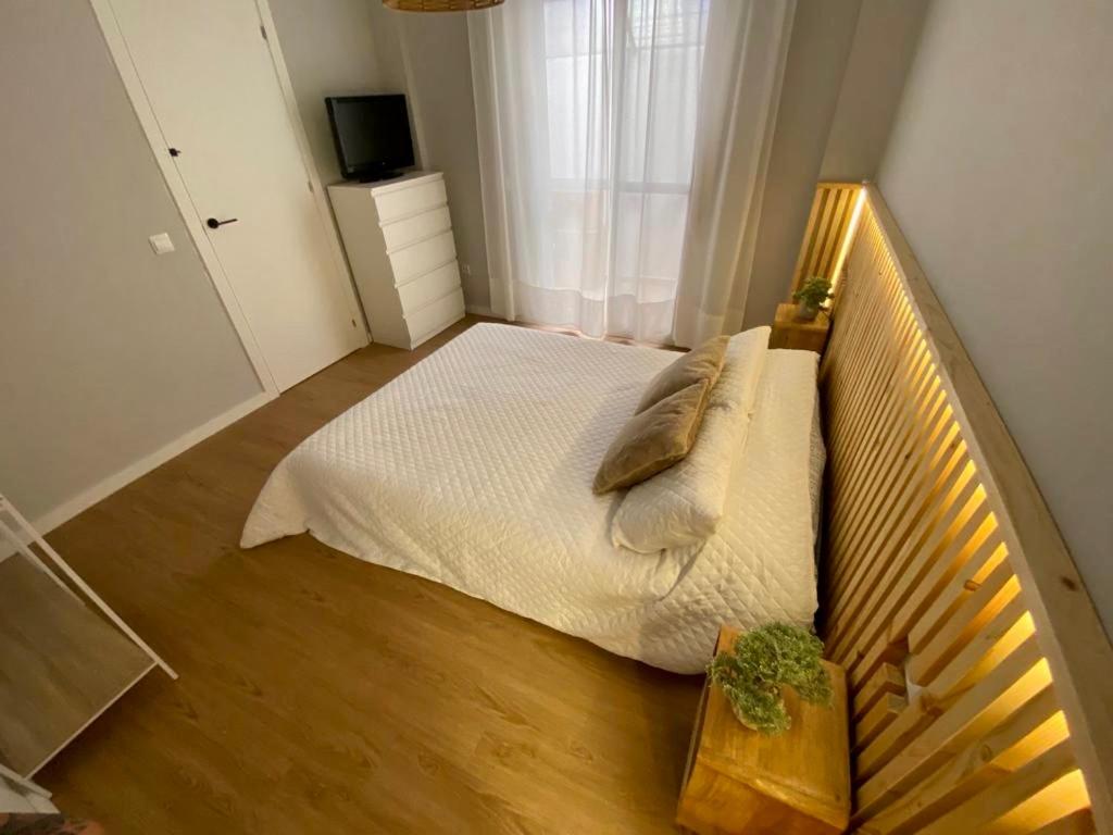 Łóżko lub łóżka w pokoju w obiekcie Amazon Malaga