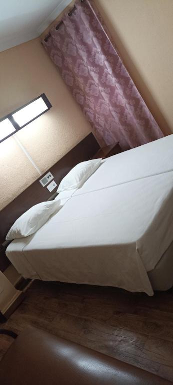 Postel nebo postele na pokoji v ubytování Residencial Sol