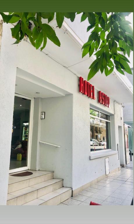 a door to a store with a sign on it at Hotel Astro in Mar del Plata