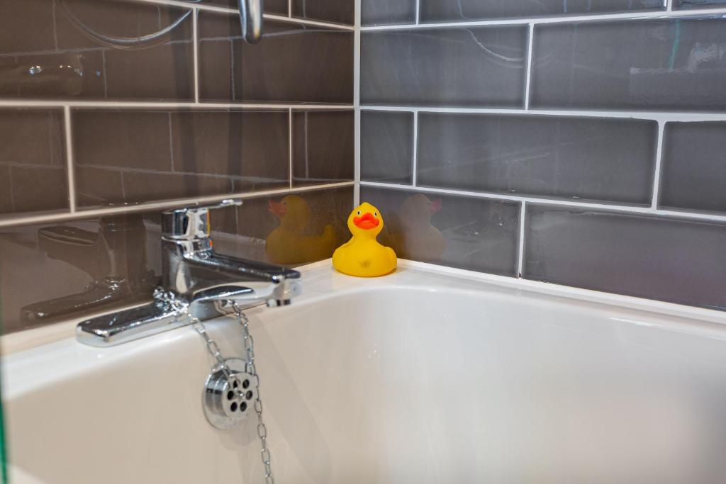 a sink with a rubber duck sitting on top of it at The Manor Coastal Hotel & Inn, Blakeney - part of The Coaching Inn Group in Blakeney