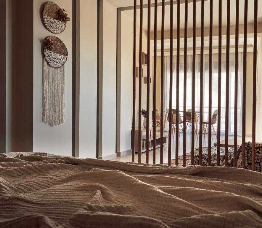 Postel nebo postele na pokoji v ubytování Laura Suites