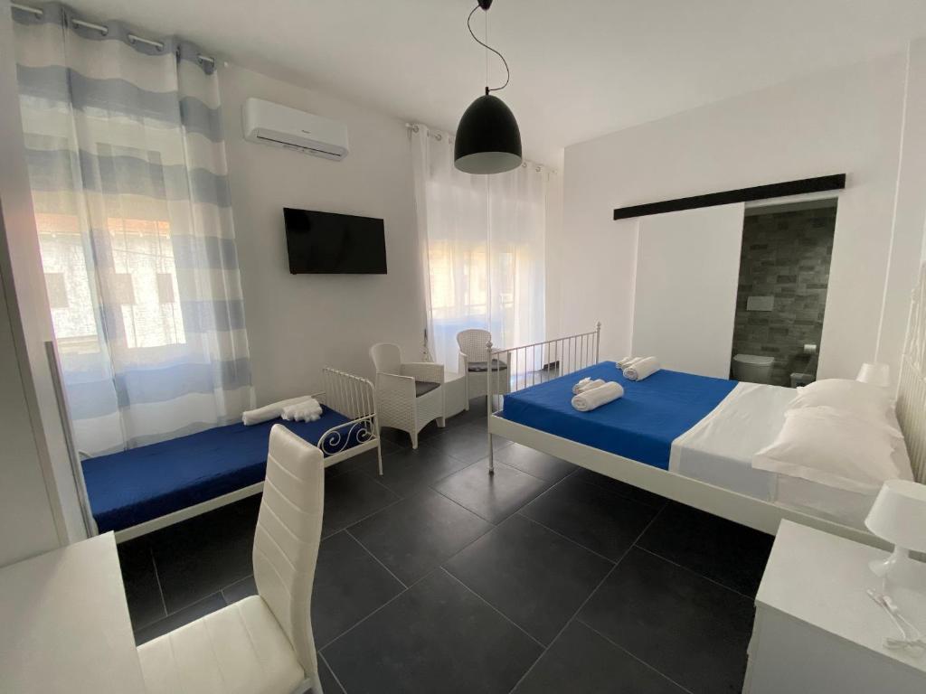 a bedroom with a bed and a desk and a tv at B&B FRONTEMARE San Salvo Marina CH in San Salvo