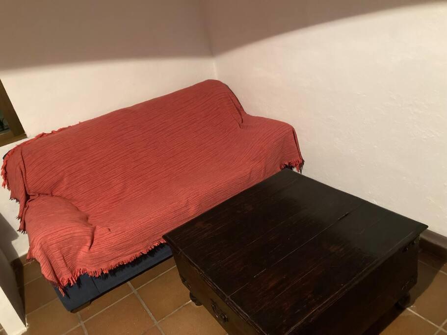 A bed or beds in a room at Casa Cueva Rural Estación de Guadix