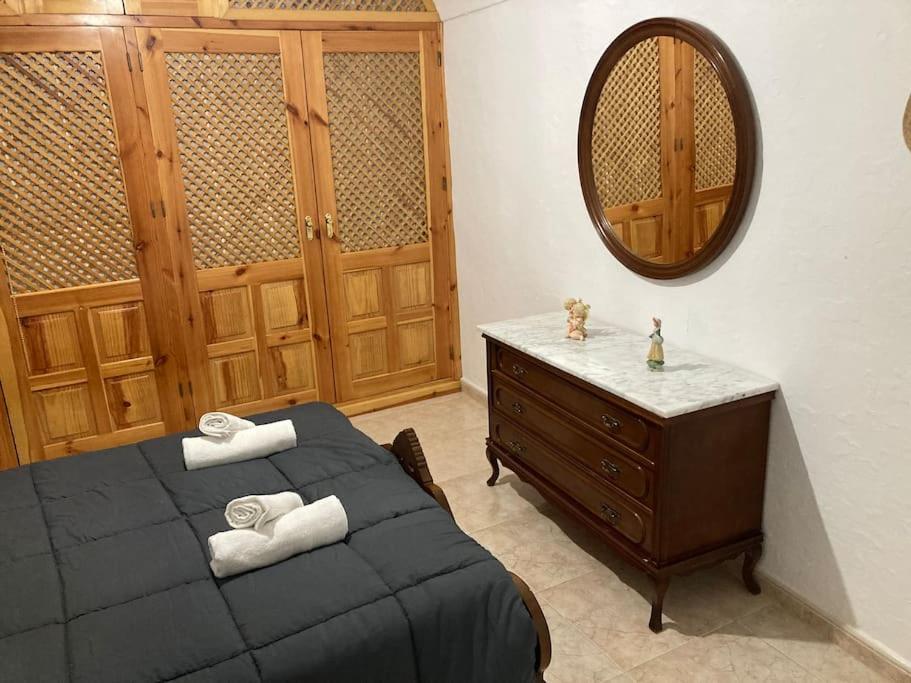 A bed or beds in a room at Casa Cueva Rural Estación de Guadix