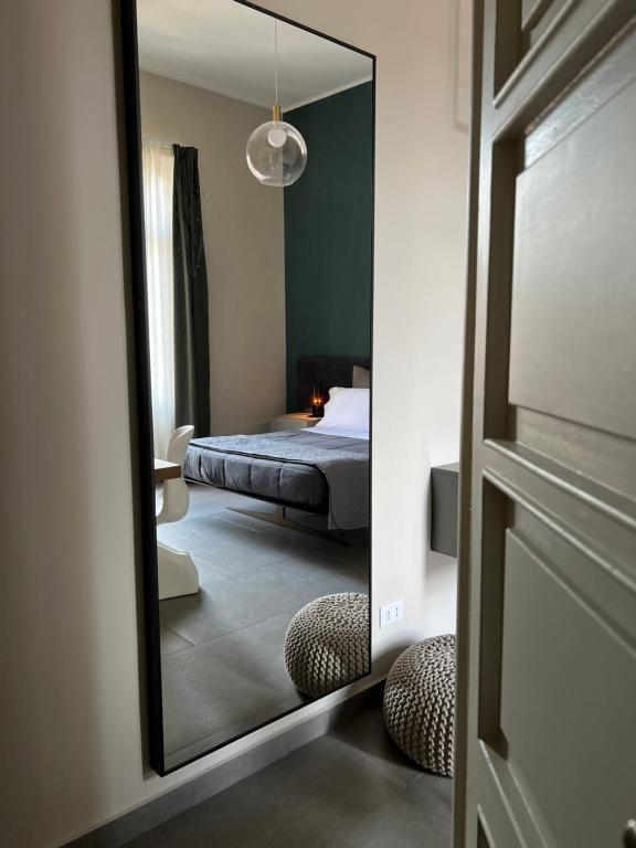A bed or beds in a room at Catania Rooms