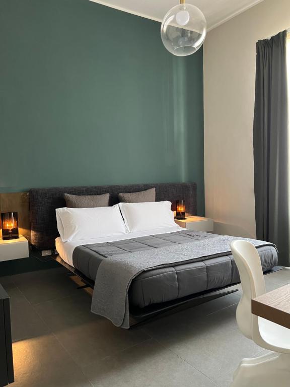 A bed or beds in a room at Catania Rooms