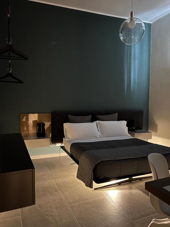 A bed or beds in a room at Catania Rooms