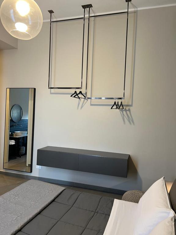 A bed or beds in a room at Catania Rooms