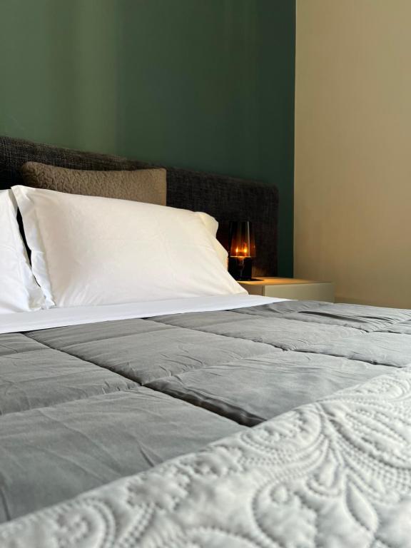 A bed or beds in a room at Catania Rooms