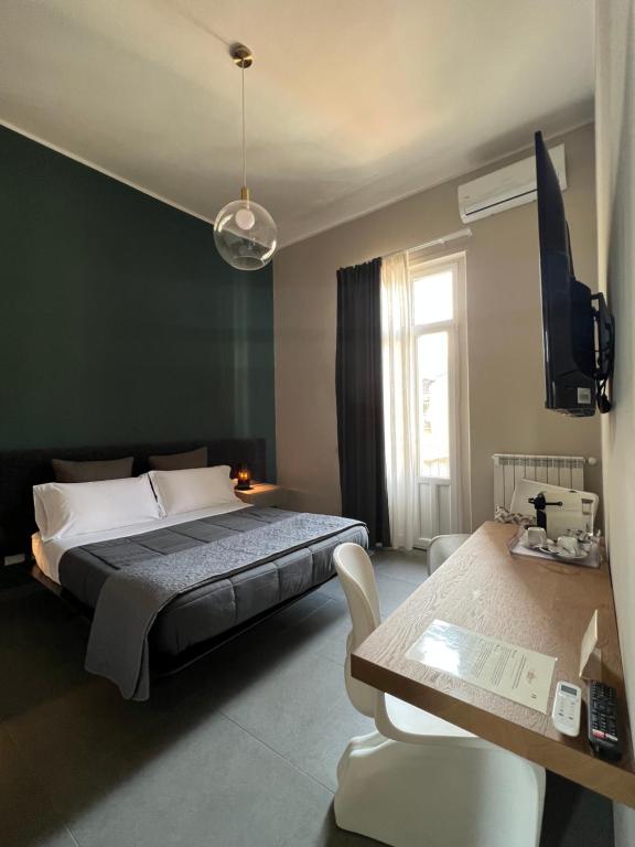 A bed or beds in a room at Catania Rooms