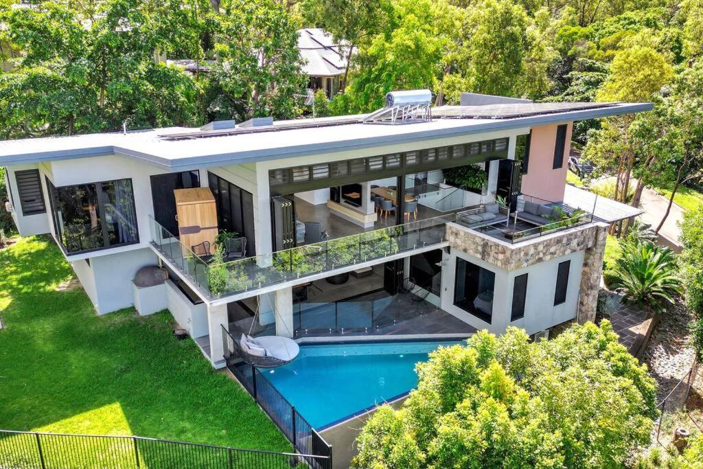 an aerial view of a house with a swimming pool at Ohana- Ultimate family escape in Kewarra Beach