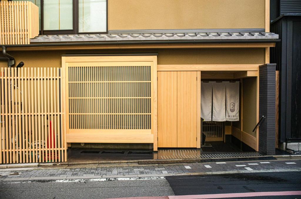 a building with two doors and a gate at Miru Kyoto Gion in Kyoto